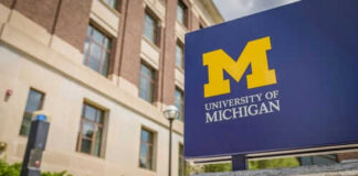 University of Michigan sign outside brick building