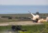Surface-to-air missile launching from a coastal battery