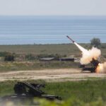 Surface-to-air missile launching from a coastal battery