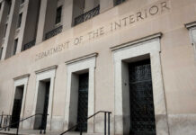 Department of the Interior building facade with tall stone entrances