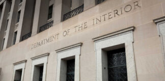 Department of the Interior building facade with tall stone entrances