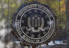 FBI’s Stunning Cache Discovery—Record-Setting! FBI seal against marbled wall background.
