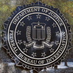 FBI seal against marbled wall background.
