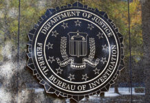 FBI seal against marbled wall background.
