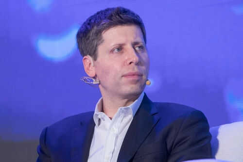 Person wearing a suit with a microphone headset