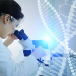 Scientist examining a sample under a microscope in a lab