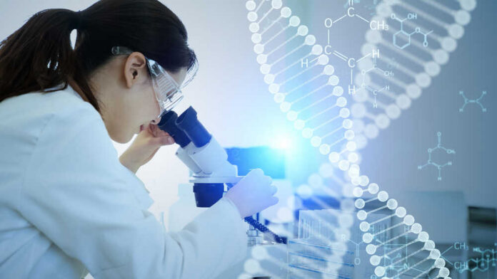 Scientist examining a sample under a microscope in a lab