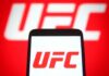 Smartphone displaying the UFC logo against a red background