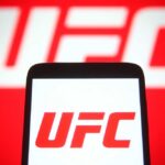 Smartphone displaying the UFC logo against a red background