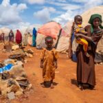 Afrikaner Priority: Bold Move or Selective Policy? Children in a makeshift camp on a dry, dusty ground