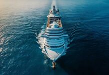 Shocking Cruise Disaster: 3 Dead, More Infected Aerial view of a large cruise ship sailing on calm ocean waters