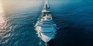 Aerial view of a large cruise ship sailing on calm ocean waters