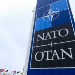 Trump’s Bold Move: NATO CHANGES Shock Europe! NATO sign with flags in the background