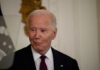 $1.7B Fund: Biden ‘Weaponization’ Payback? A man in a pinstripe suit smiling in an indoor setting