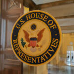 Loyalty Test: Congress Faces Citizenship Amendment US House of Representatives seal on glass door