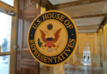 US House of Representatives seal on glass door