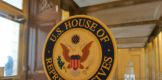 US House of Representatives seal on glass door