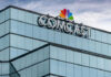 Comcast’s Bold Gamble Signals Bigger Changes Glass building featuring Comcast logo with NBC peacock symbol