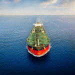 Oil tanker sailing straight through calm open sea