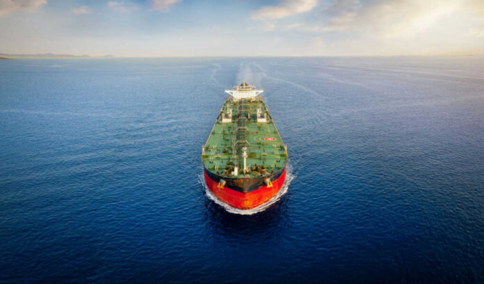 Oil tanker sailing straight through calm open sea