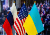 Russian, American, and Ukrainian flags side by side
