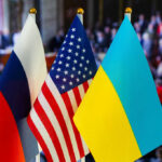 Russian, American, and Ukrainian flags side by side