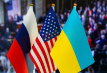 Russian, American, and Ukrainian flags side by side