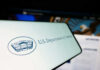 U.S. Department of Defense logo on a screen.