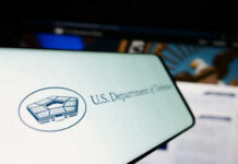 U.S. Department of Defense logo on a screen.