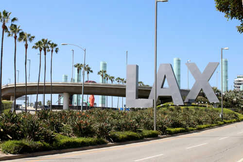 lax1958136745jpg LAX sign with palm trees and blue sky