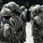 Covert Ties Exposed—Denials Fly Soldiers in camouflage uniforms standing in formation