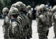 Soldiers in camouflage uniforms standing in formation