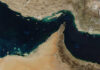 Drone Swarm Thwarted Near Hormuz Satellite view of the Persian Gulf and surrounding geographical features