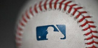 Close-up of a baseball featuring the MLB logo