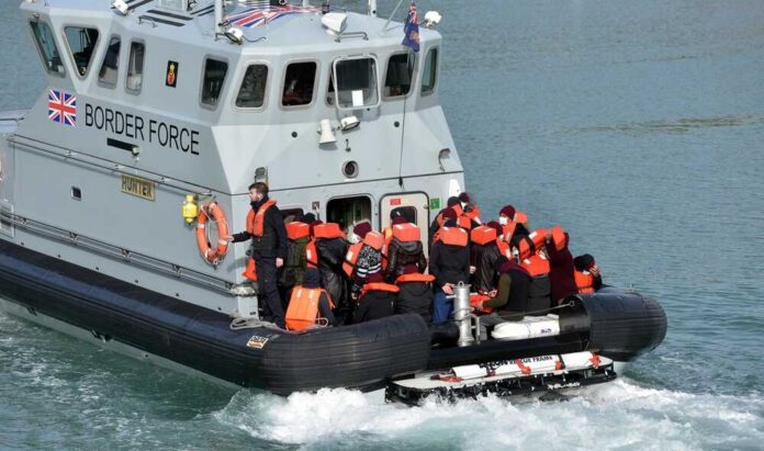 Dover,,Kent,,Uk,,9th,September,2023,,Migrants,Brought,Ashore,By Border Force boat with migrants wearing life jackets