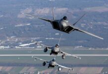 Israel Strikes Deep — Tehran Shaken Three military fighter jets flying in formation above a landscape