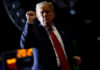 Shutdown Ends, Border Crackdown Moves Forward Person with raised fist in dark background.