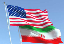 Hardball: Trump Freezes Iran Ceasefire Clock American and Iranian flags waving in the sky.