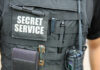 Tactical vest with equipment and a visible service patch