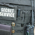 Tactical vest with equipment and a visible service patch