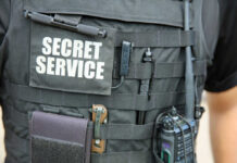 Tactical vest with equipment and a visible service patch