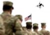 Did America Get What It Paid For? soldiers watch a drone fly near an american flag