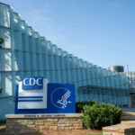 CDC headquarters building with signage and blue sky