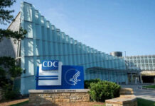 CDC Workforce Shrinks Amid Budget Fight CDC headquarters building with signage and blue sky