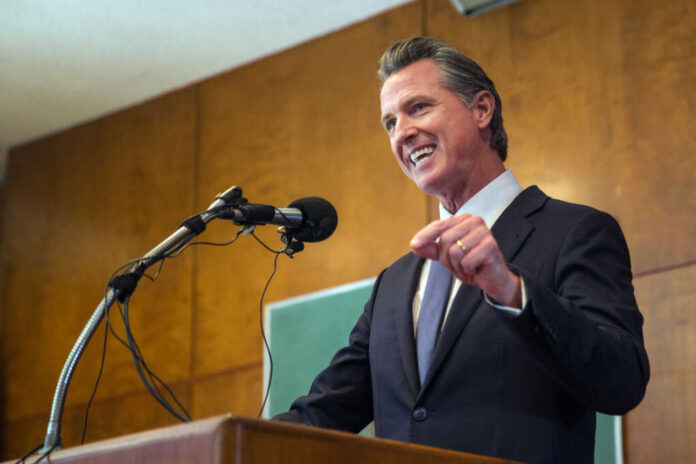 Man speaking at podium with microphone