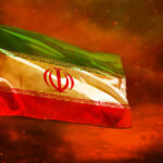 Diplomacy Or Deterrence—Time’s Running Out Iranian flag waving against a dramatic orange sky
