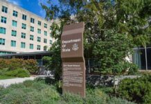 Trump’s Loyalty Test Reaches America’s Diplomats Department of State sign outside an office building