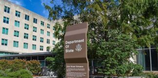 Department of State sign outside an office building