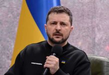 Ukraine’s Gambit: Loomer Becomes The Channel man holding a microphone during a talk