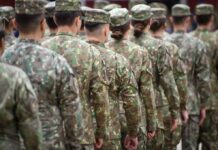 Military Justice Still Faces A Credibility Test Soldiers in camouflage uniforms standing in formation from behind